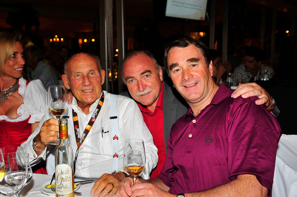 Stirling Moss und Nigel Mansell mit Willi Opitz